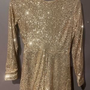 Gold sparkly short romper size M.